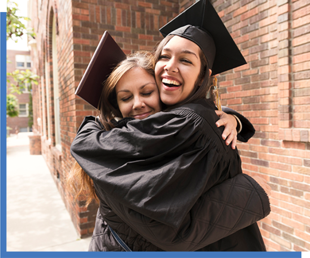 Two graduates celebrating.