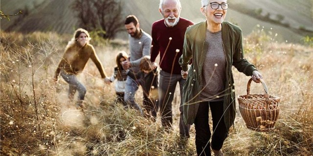 Family enjoying retirement by going for a hike.
