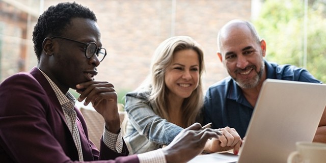 WFG agent discusses financial literacy with interested clients.