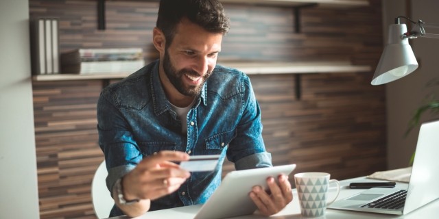 Man making a purchase on a tablet