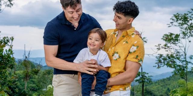 Two parents holding their child
